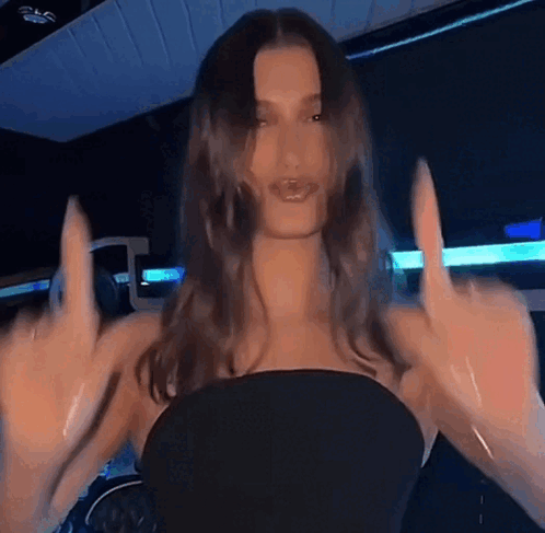 Woman in Black Dress Giving Middle Finger