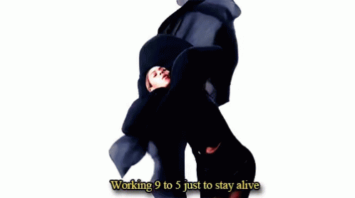 Woman in Black Dress Holding Cloth Over Head Saying Working 9 to 5 Just to Stay Alive