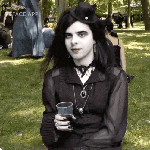 Woman in Black Dress Holding Plastic Cup