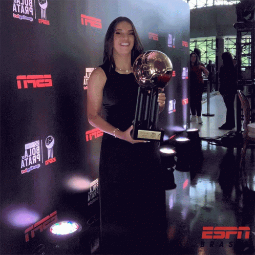 Woman in Black Dress Holding Trophy ESPN Brasil