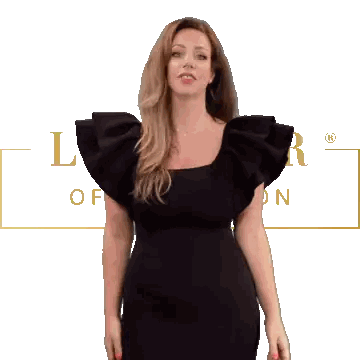 Woman in Black Dress in Front of L of London Sign