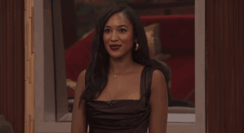 Woman in Black Dress in Front of Live Sign