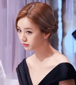 Woman in Black Dress Looking Serious