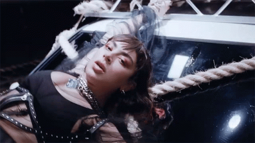 Woman in Black Dress Lying on Rope