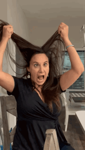 Woman in Black Dress Making Funny Face