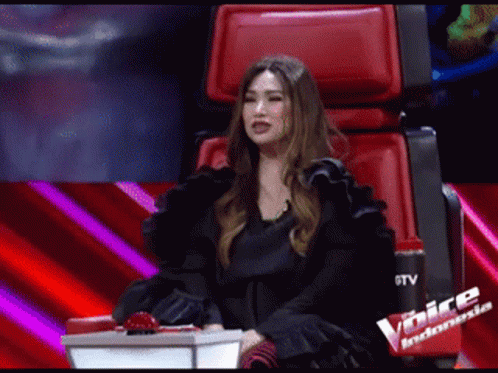 Woman in Black Dress on Red Chair The Voice Indonesia