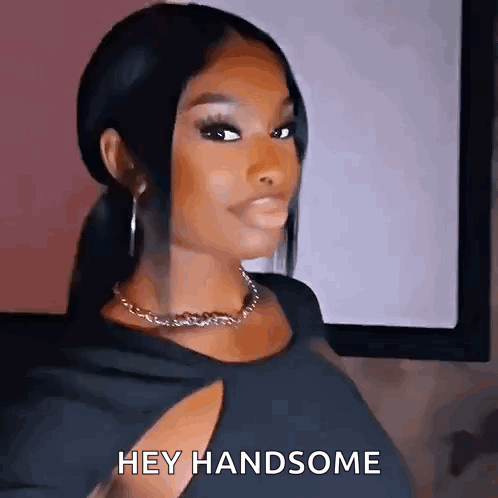 Woman in Black Dress Saying Hey Handsome