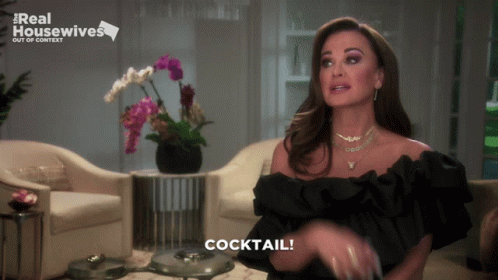 Woman In Black Dress Says Cocktail Real Housewives Sign GIF