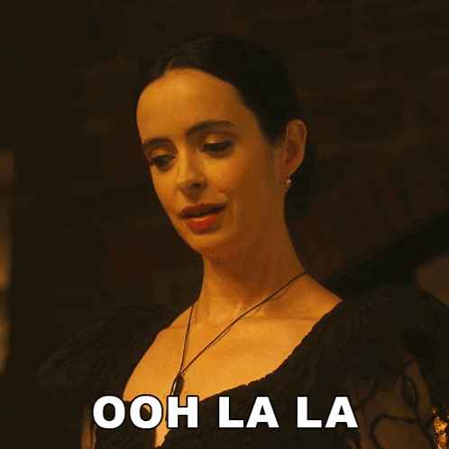 Woman In Black Dress Says Ooh Lala GIF