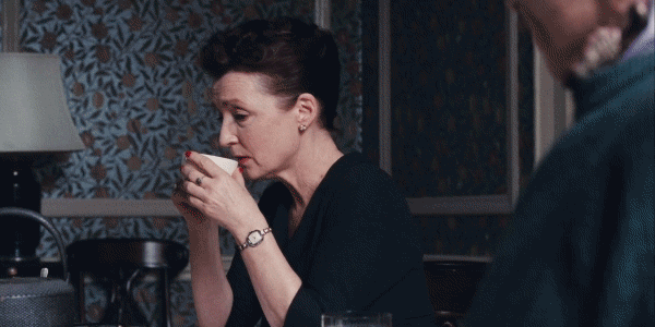 Woman In Black Dress Sipping Tea GIF