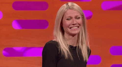 Woman in Black Dress Smiling and Laughing