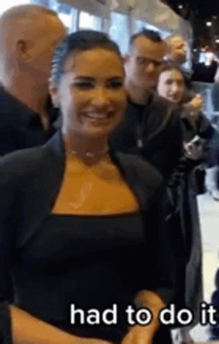 Woman In Black Dress Smiling GIF