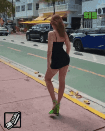 Woman in Black Dress Standing by S19 Sign