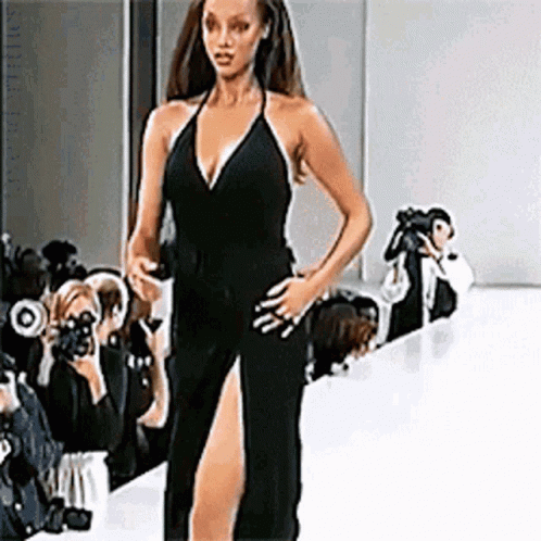 Woman In Black Dress Walking Runway GIF