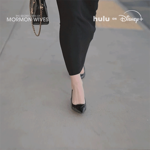Woman in Black Dress Walking The Secret Lives of Mormon Wives
