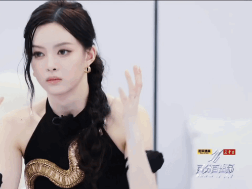 Woman in Black Dress with Gold Snake