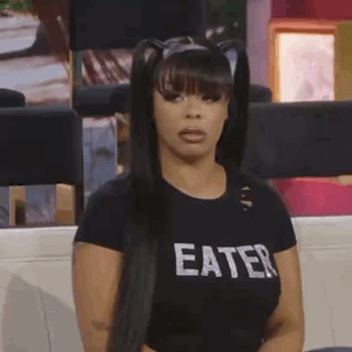 Woman in Black Eater Shirt on Couch
