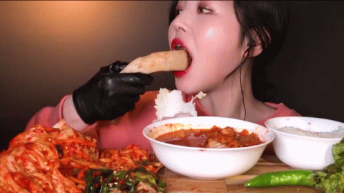 Woman in Black Gloves Eating