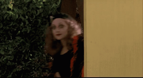 Woman In Black Hat And Earrings Says Yeth GIF
