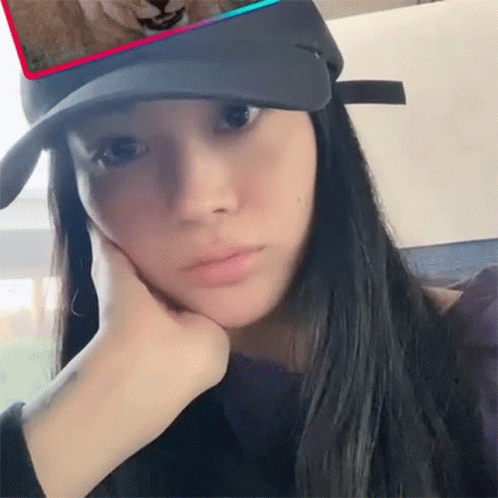 Woman In Black Hat Covering Face GIF