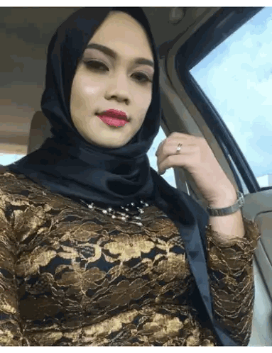 Woman in Black Hijab and Gold Dress