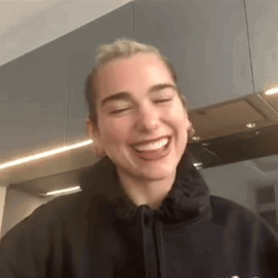 Woman in Black Hoodie Laughing