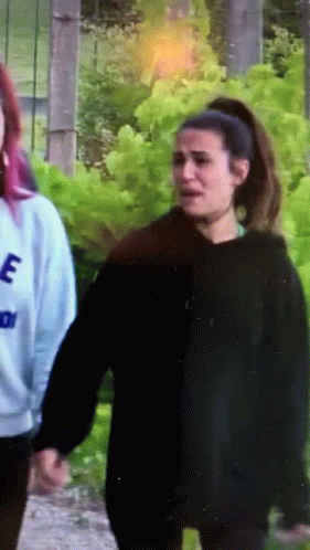 Woman In Black Hoodie With Letter E GIF