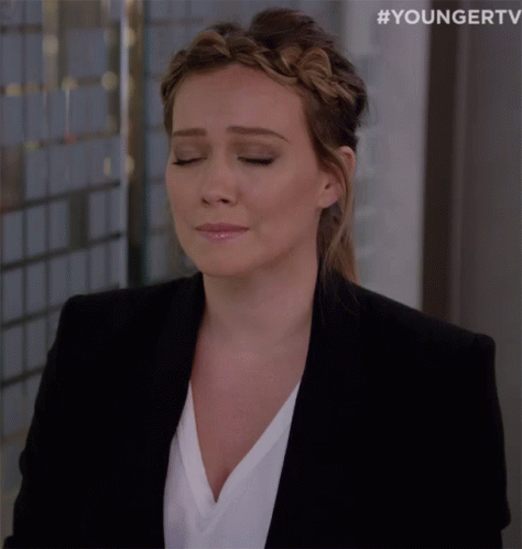 Woman in Black Jacket and Braided Headband Eyes Closed
