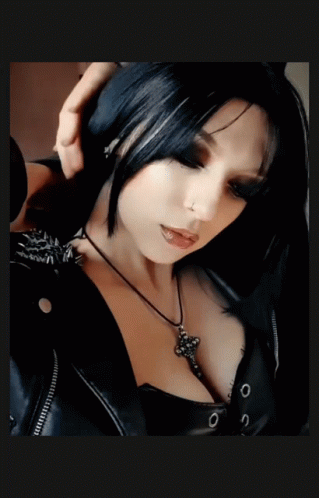 Woman in Black Jacket and Cross Necklace