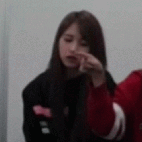 Woman in Black Jacket and Red Sweater Beside Man in Red Jacket