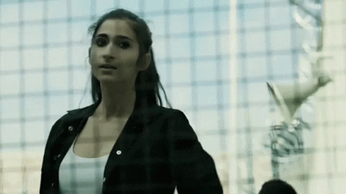 Woman in Black Jacket and White Tank Top