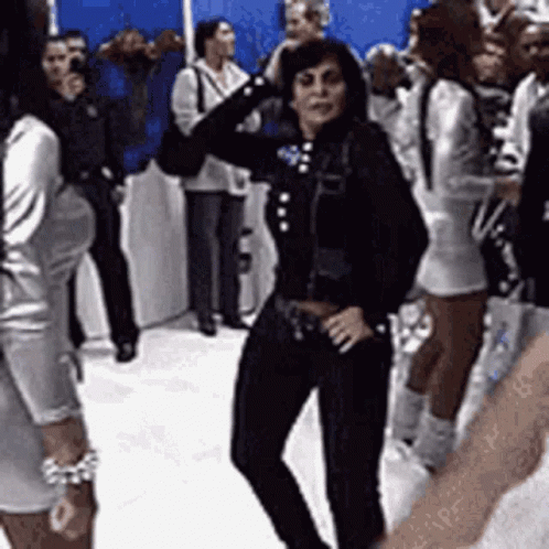 Woman In Black Jacket Dancing In Crowd GIF