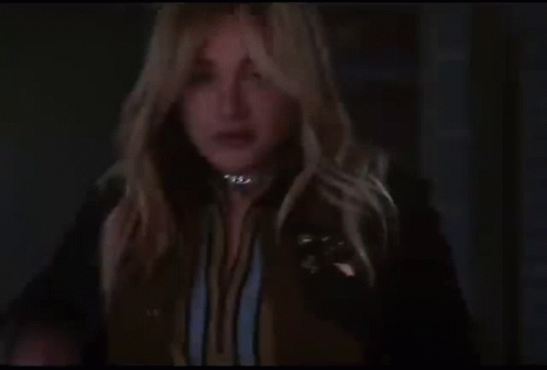 Woman In Black Jacket Holding Glass Saying Hi GIF