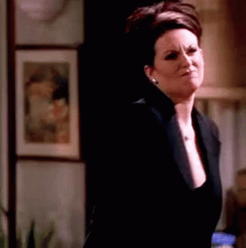 Woman In Black Jacket In Dark Room GIF