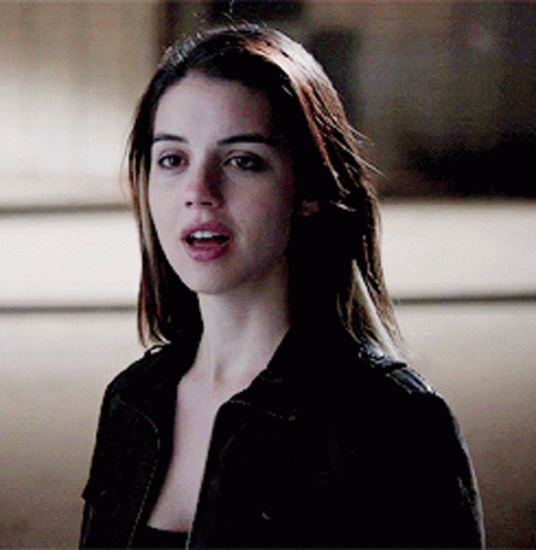 Woman In Black Jacket Looking At Camera GIF