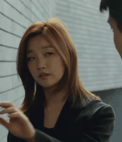 Woman In Black Jacket Talking To Woman GIF