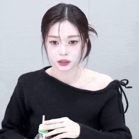 Woman in Black Off the Shoulder Sweater Drinking