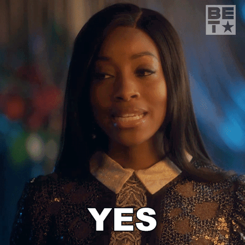 Woman in Black Sequined Jacket Saying Yes