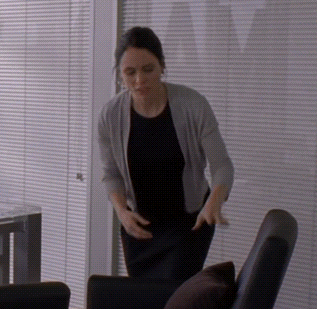 Woman in Black Shirt and Grey Cardigan