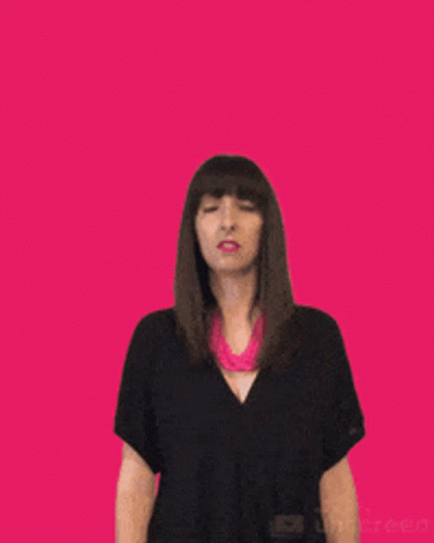 Woman in Black Shirt and Pink Necklace Waving