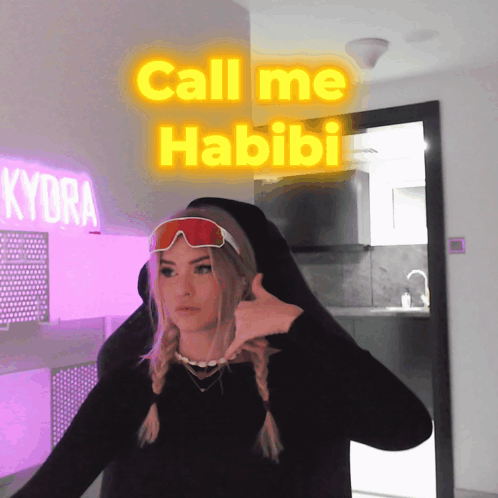 Woman in Black Shirt and Red Goggles Saying Call Me Habibi