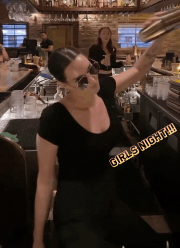 Woman in Black Shirt at Girls Night Bar