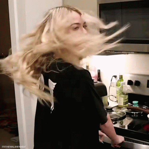 Woman In Black Shirt Hair Blowing GIF