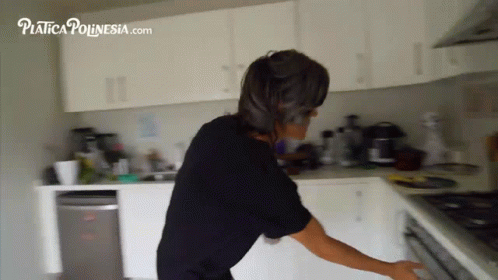 Woman in Black Shirt in Kitchen with platica ponesia.com