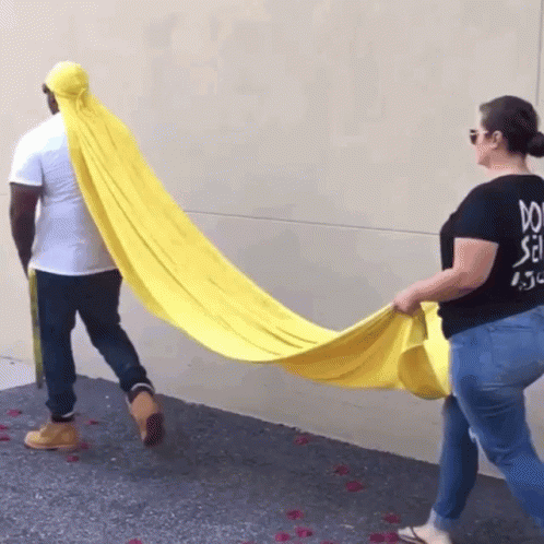 Woman in Black Shirt Saying Do Holding Yellow Blanket