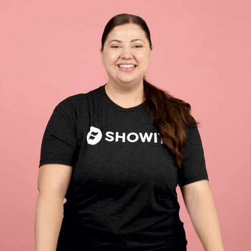 Woman in Black Shirt Saying Showi Smiling
