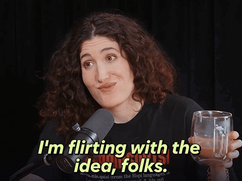 Woman in Black Shirt Says I'm Flirting With the Idea Folks