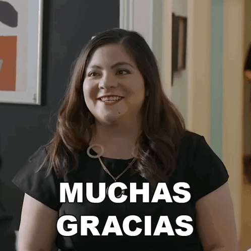 Woman in Black Shirt Says Muchas Gracias