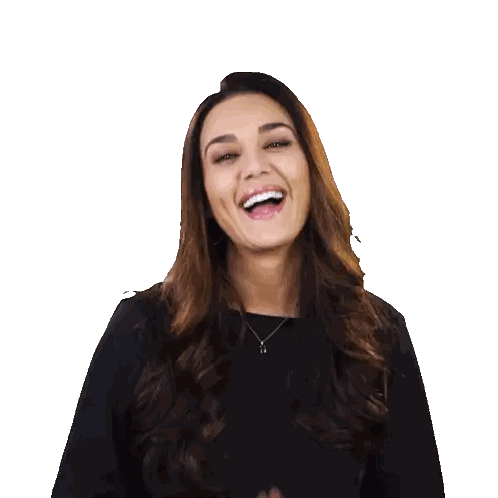 Woman in Black Shirt Smiling with Hands Folded