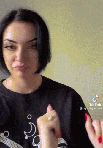 Woman in Black Shirt With TikTok Sticker